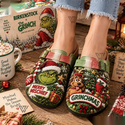 Grinch Merry Mischief clogs worn with jeans